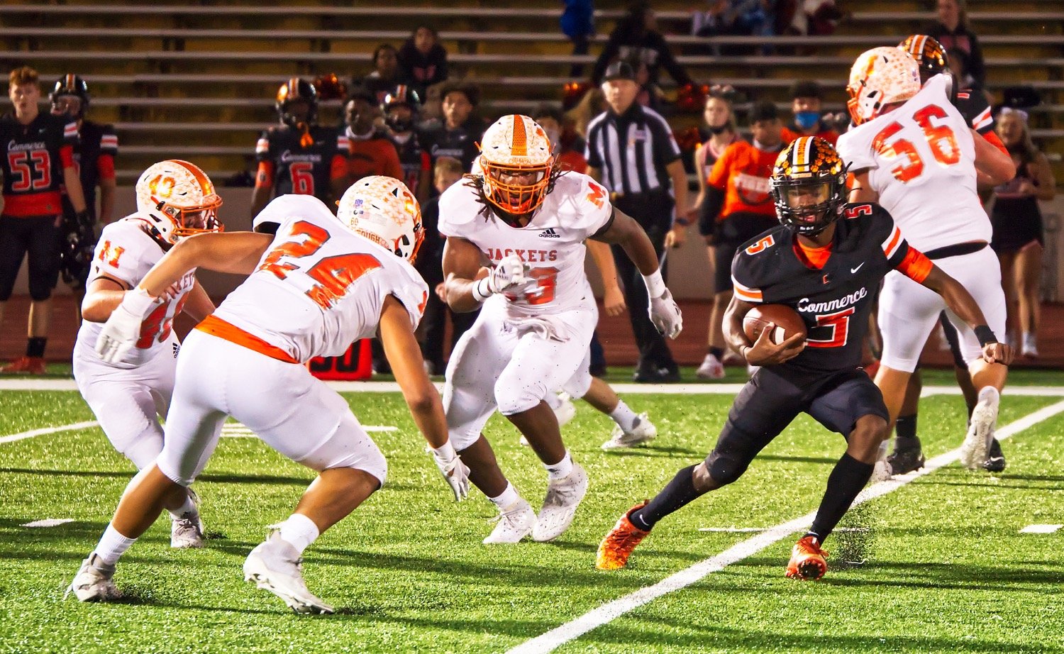 Hunter Wright (40), Kobe Kendrick (24), and Trevion Sneed have the crafty Commerce quarterback surrounded, with almost nowhere to run. Jackson Anderson (56) was name offensive lineman of the year.  Wright was named to first team on both offense and defense. Kendrick was selected defensive MVP and Sneed was chosen all-district MVP. [print available]